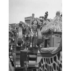  Children Riding Rides at Amusement Park at Beach Premium 