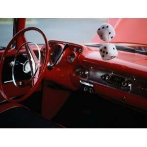  Fuzzy Dice and Cherry Red Interior of a Classic Car 