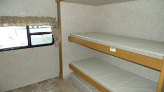 2012 EVERLITE 35RBS DOUBLE SLIDE BUNKHOUSE WITH OUTSIDE KITCHEN 32BHDS 