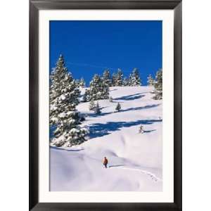  A Hiker Snowshoeing a Trail in Fresh Powder Seasons Framed 