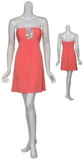 Delightful coral cocktail dress. Strapless neckline with sexy V notch 