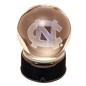North Carolina University logo etched in a lit, musical and turning 