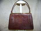   ALLIGATOR PURSE WITH BRASS TRIM AND BUTTONS ON BOTTOM GOOD CONDITION