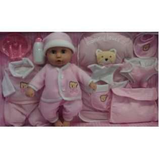 Baby 15 doll with extra outfit, sleeping beg, diaper And diaper bag 