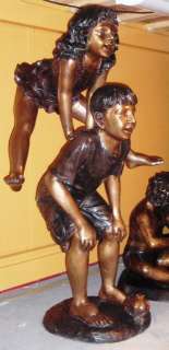 Cast Bronze Boy and Girl Playing Leap Frog Statue  