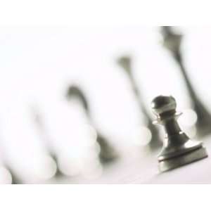 Silver Pawn on Chess Board with Blurred Chess Pieces Photographic 