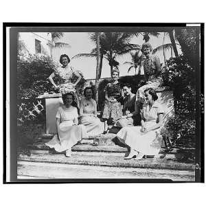  Barbara Hutton,center,with group of women and dog,1954 