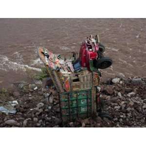  A Truck Lays Wrecked on the River Bank of the Jhelum River 